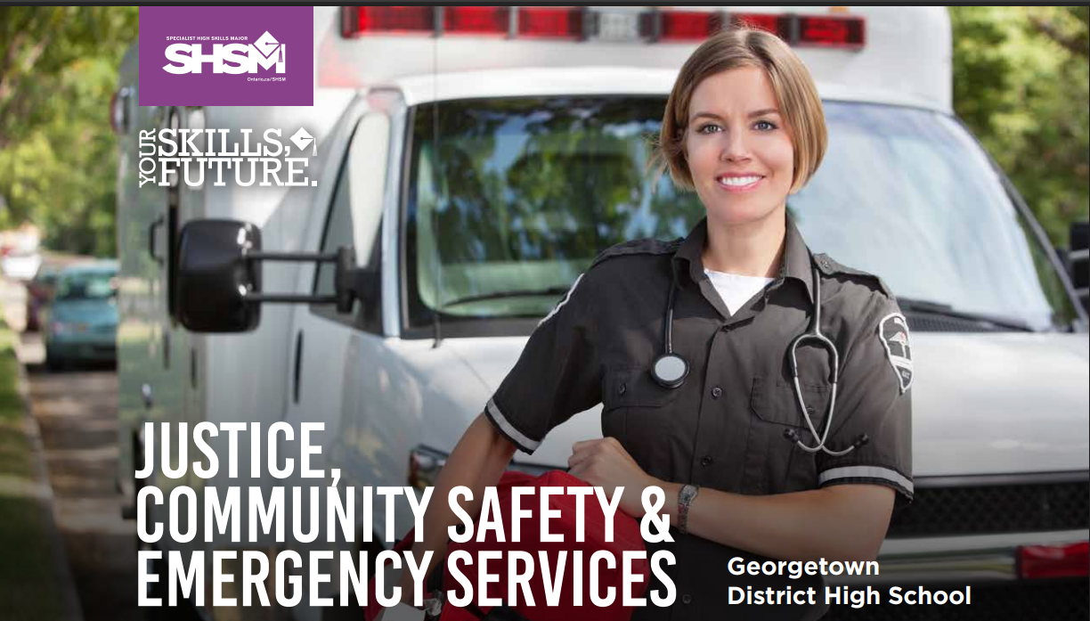 a woman in a paramedic outfit standing in front of an ambulance.