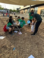 Students outside at Stem Night doing crafts