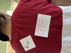 Picture of a student with a note on her back