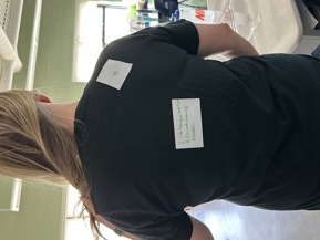 Student with a note on her back