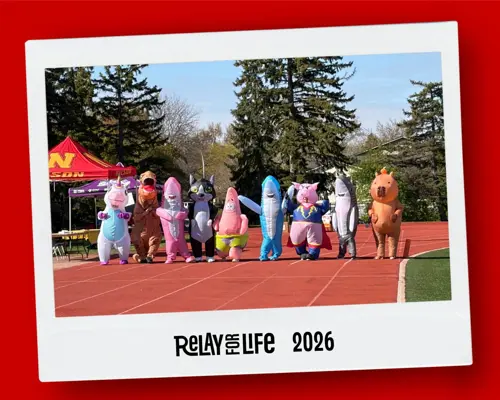 Nelson teachers wearing inflatables and getting ready to have a running race at the Relay for life