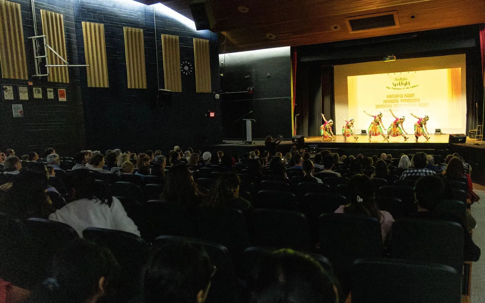 Audience watches student performers on stage during the Students in the Spotlight showcase at Burlington Central School