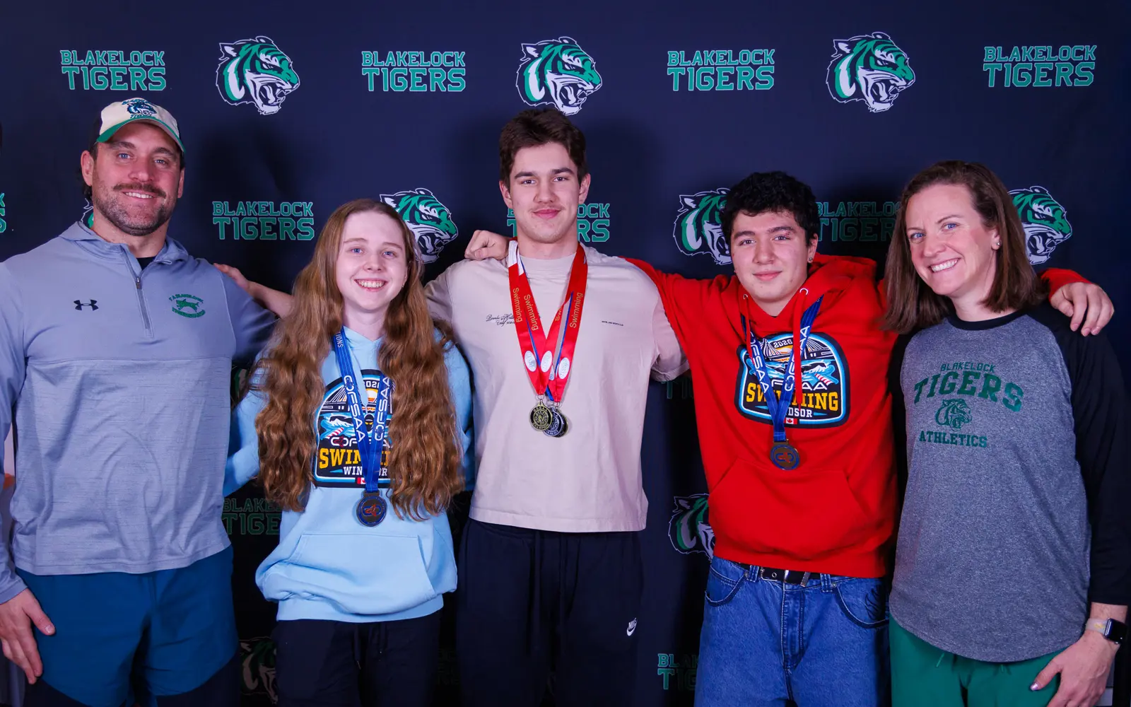 Petar Jokic, Melanie Heuft, JJ Rubanovich, Zayden Dindayal and Olympian coach Annamay Oldershaw, T.A. Blakelock High School swim team