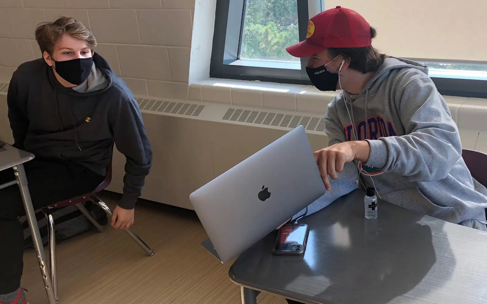 M.M. Robinson High School students collaborating on their Pecha Kucha multimedia project connecting in-person and virtual learners