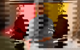 Presenter talking to a group of people 