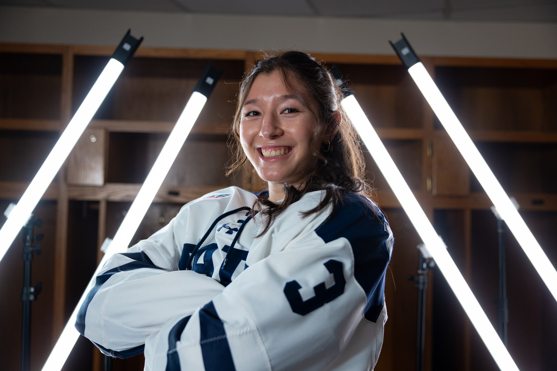 a girl in a hockey uniform