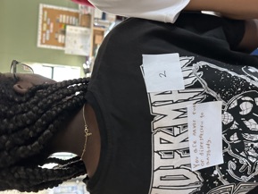 Picture of a student with a note on her back