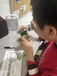 Student planting seeds