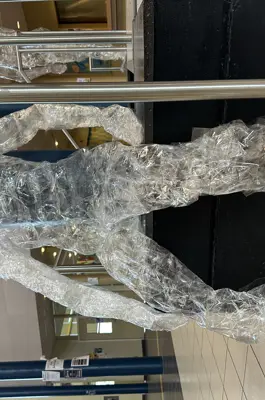 a statue of a human silhouette made of clear material. 