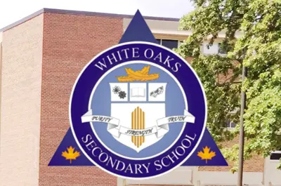 a school crest overlapping an image of a tress in front of a building. 